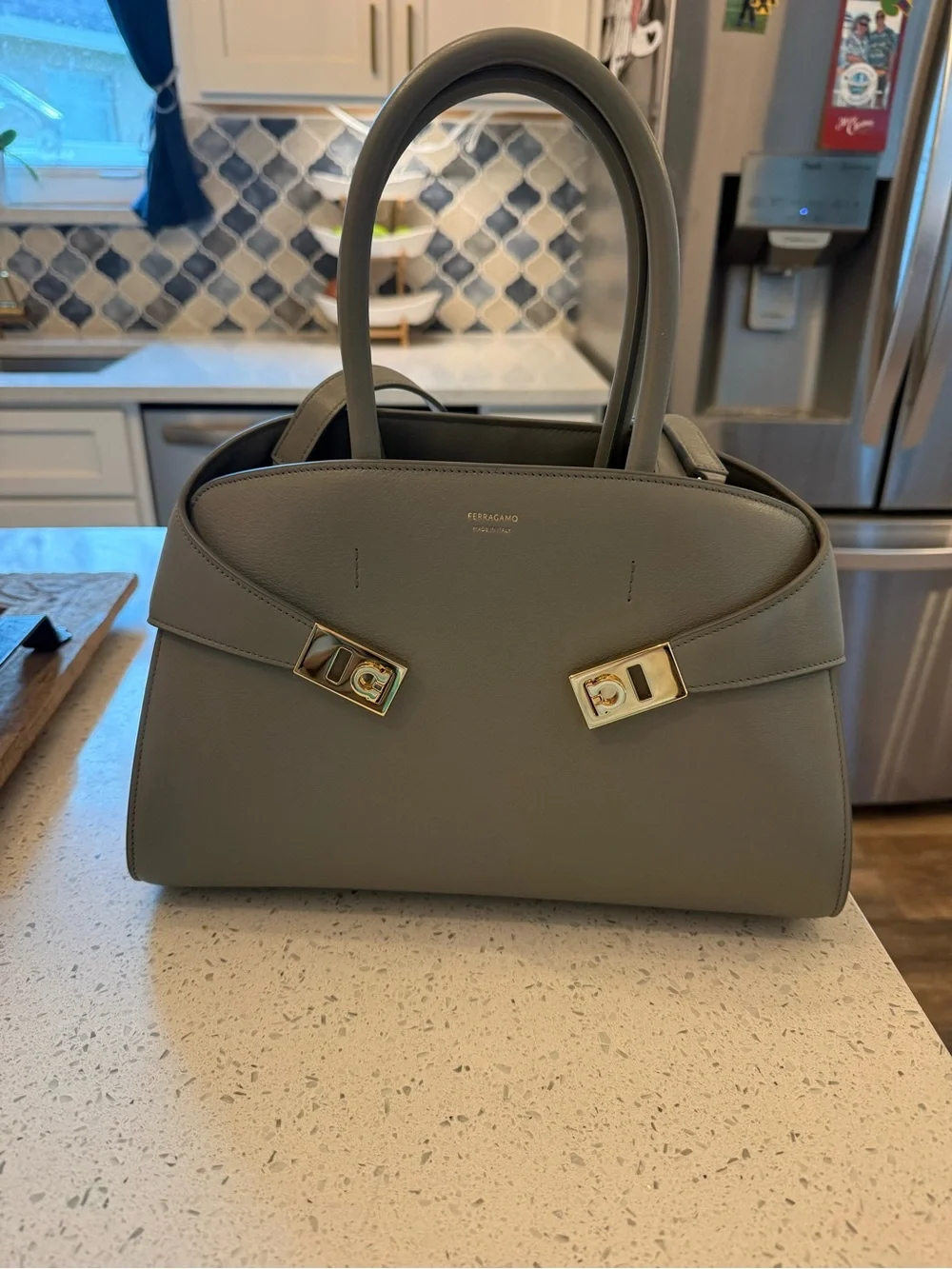 BRAND NEW NEVER WORN Ferragamo Grey Hug Bag with Gold Hardware